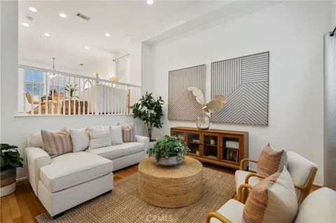 a living room with furniture flower pot and a fireplace