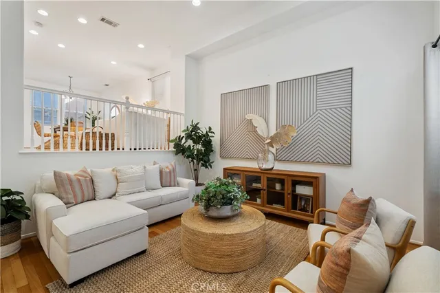 a living room with furniture flower pot and a fireplace