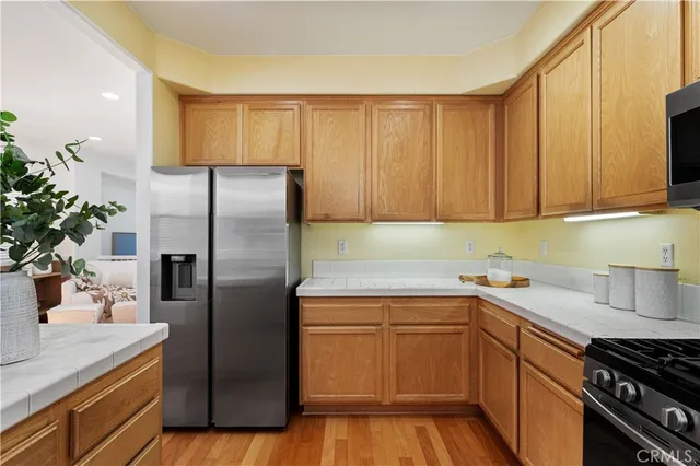 a kitchen with a sink and refrigerator