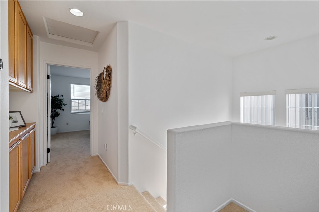 25481 Dodge Avenue, Unit 12 Harbor City, CA 90710 - Photo 19 of 35 a view of a hallway with a livingroom and a bathroom