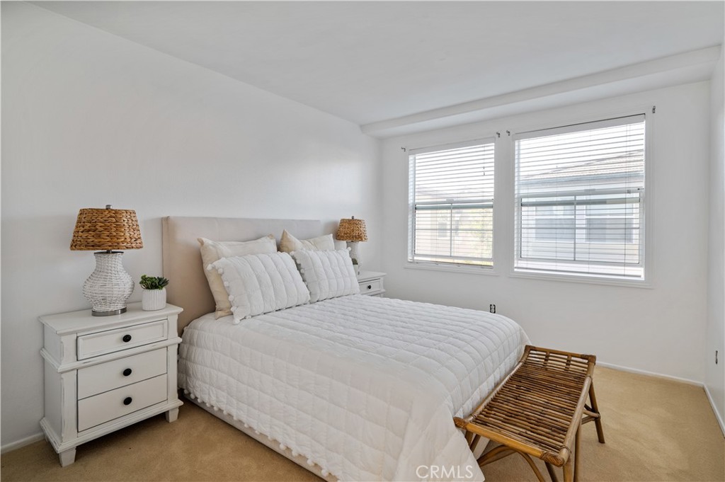 25481 Dodge Avenue, Unit 12 Harbor City, CA 90710 - Photo 26 of 35 a bedroom with a bed and window with lamp