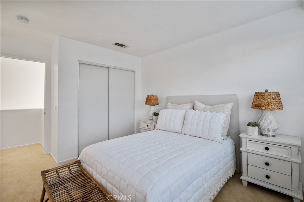 25481 Dodge Avenue, Unit 12 Harbor City, CA 90710 - Photo 27 of 35 a bedroom with a bed and a window