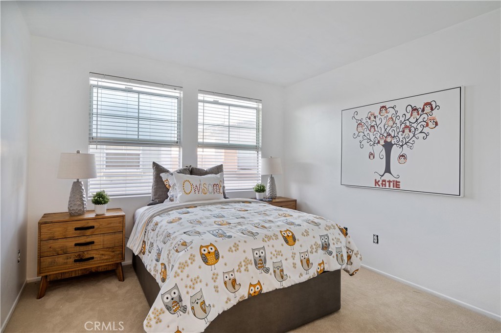 25481 Dodge Avenue, Unit 12 Harbor City, CA 90710 - Photo 28 of 35 a bedroom with a bed and a window