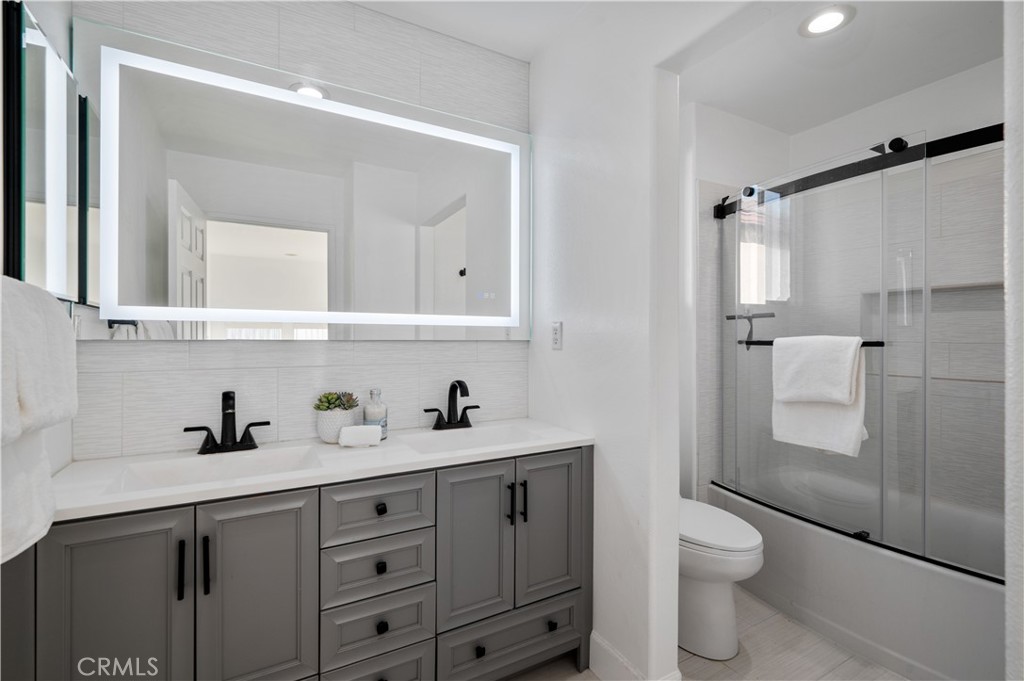 25481 Dodge Avenue, Unit 12 Harbor City, CA 90710 - Photo 29 of 35 a bathroom with a sink a toilet and shower