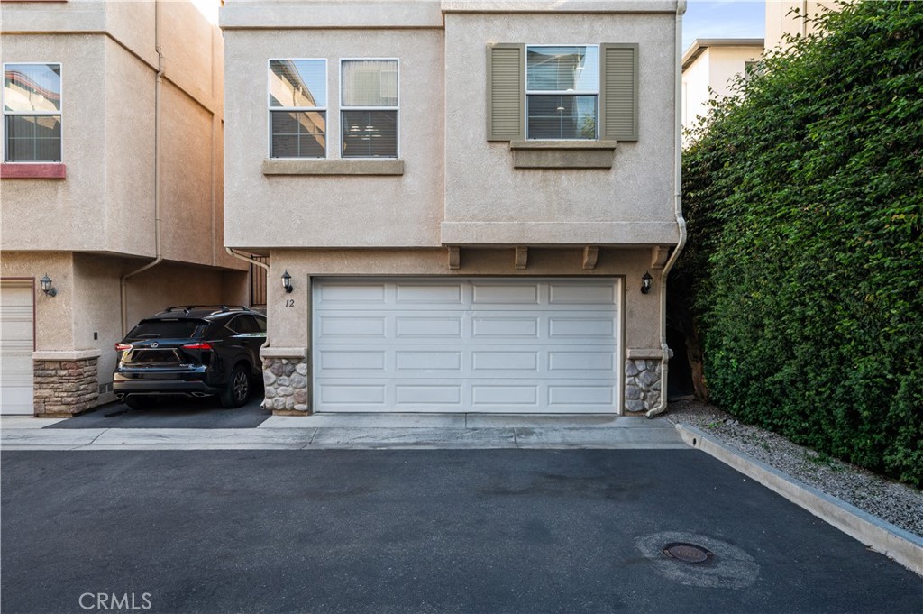 25481 Dodge Avenue, Unit 12 Harbor City, CA 90710 - Photo 33 of 35 a car parked in front of a house