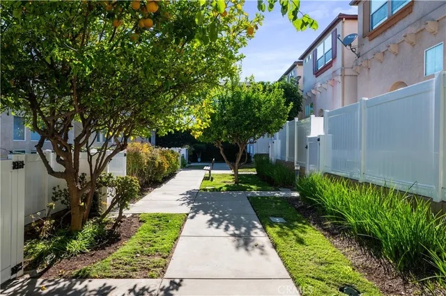 a view of a pathway with house on both side