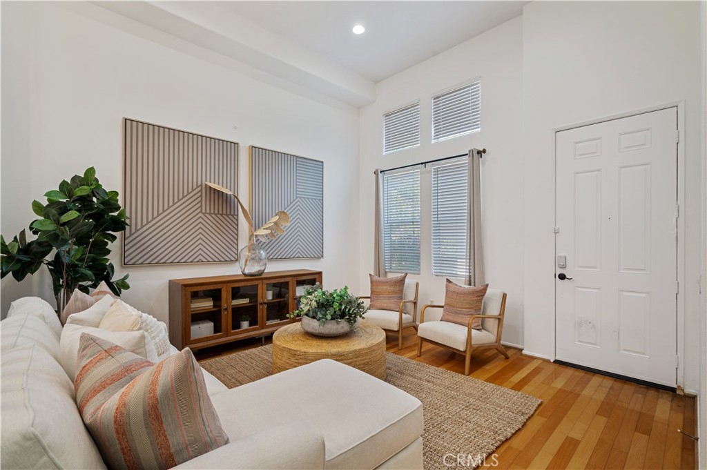 25481 Dodge Avenue, Unit 12 Harbor City, CA 90710 - Photo 6 of 35 a living room with furniture a fireplace and a potted plant