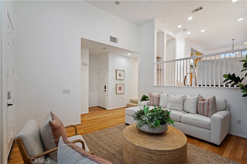25481 Dodge Avenue, Unit 12 Harbor City, CA 90710 - Photo 7 of 35 a living room with furniture kitchen and a chandelier