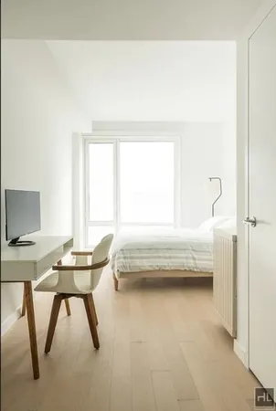a bathroom with a tub sink and a window