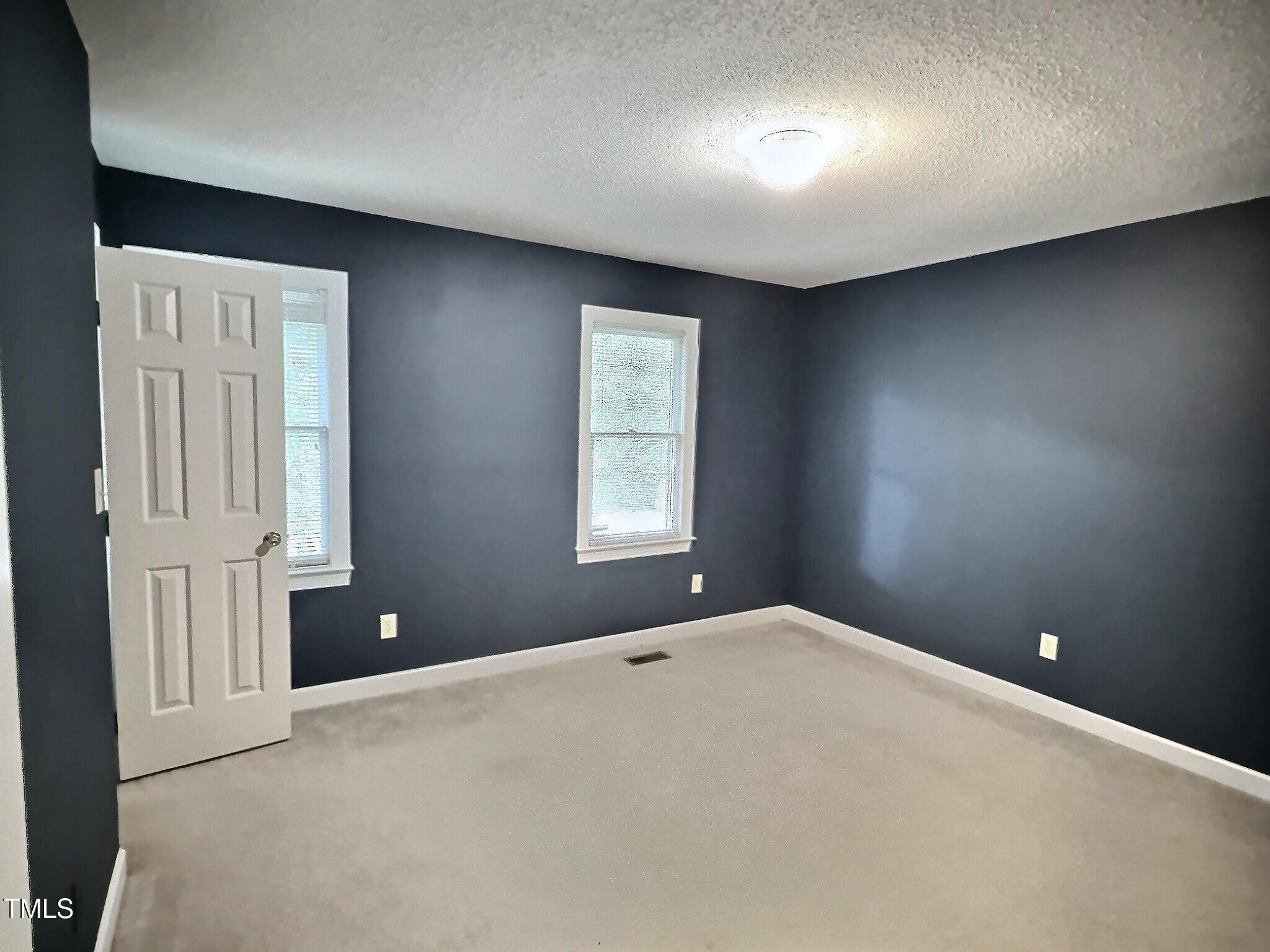 7 Preakness Drive Durham, NC 27713 - Photo 14 of 32 a view of an empty room with a window