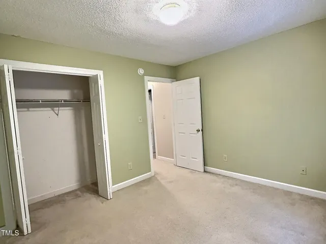 an empty room with closet