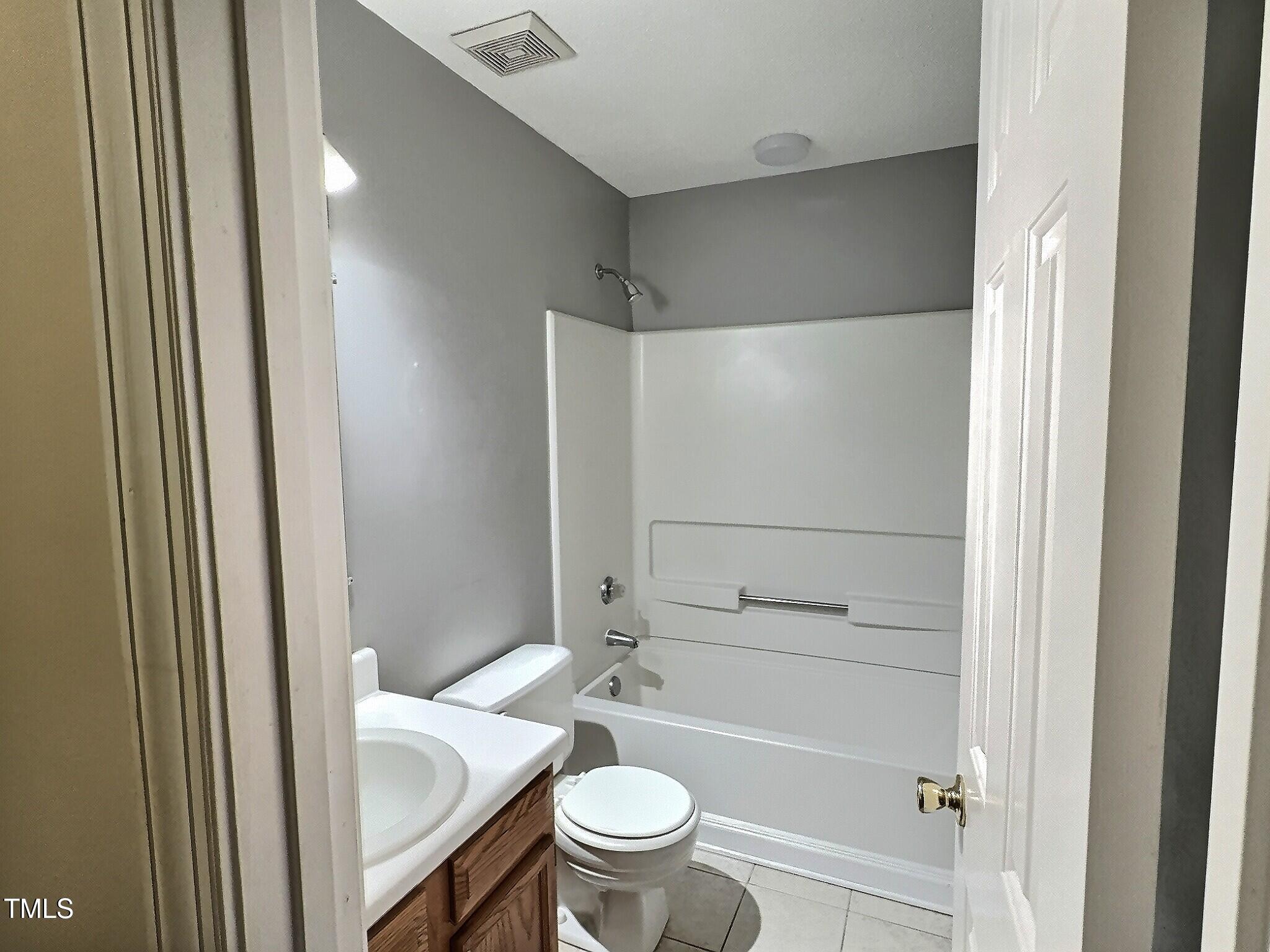 7 Preakness Drive Durham, NC 27713 - Photo 28 of 32 a bathroom with a shower and a toilet