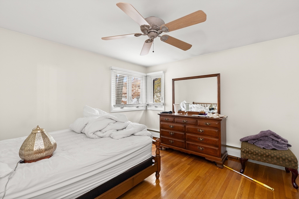 15 Quebec Court Lynn, MA 01905 - Photo 13 of 23 a bedroom with a bed and a dresser