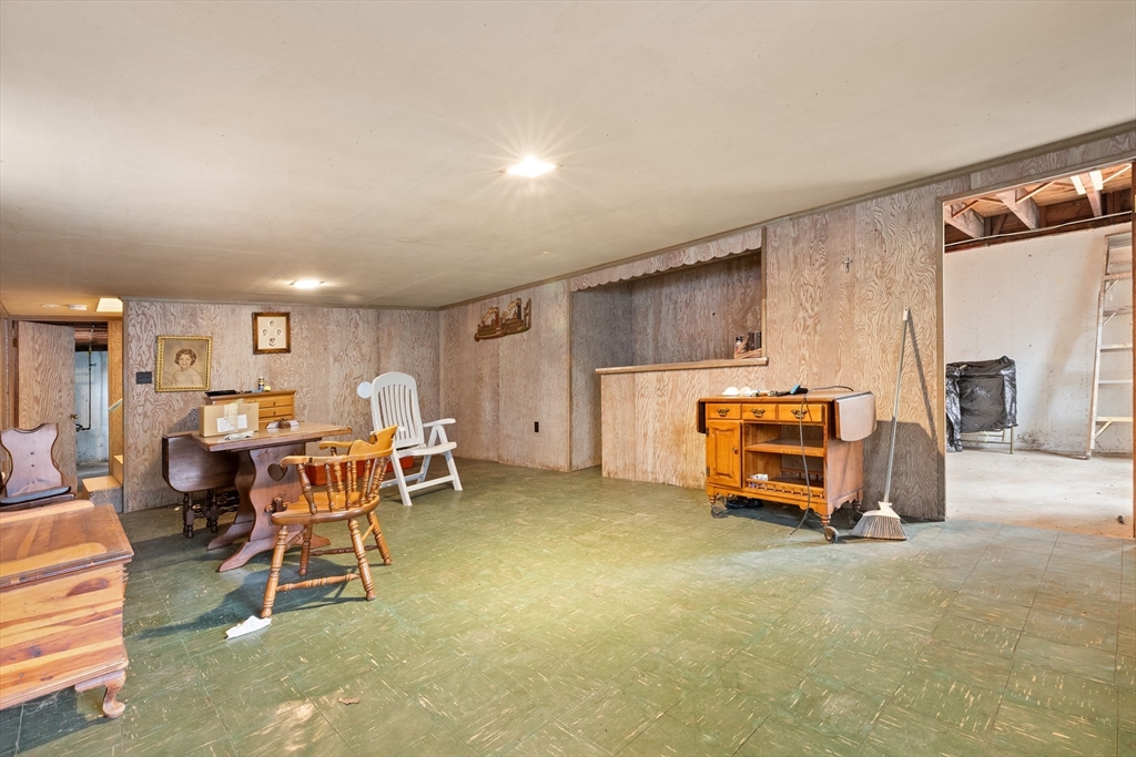 15 Quebec Court Lynn, MA 01905 - Photo 16 of 23 a living room with furniture a pool table and a window