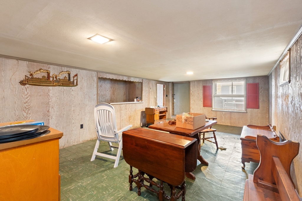 15 Quebec Court Lynn, MA 01905 - Photo 17 of 23 a living room with furniture a table and a window