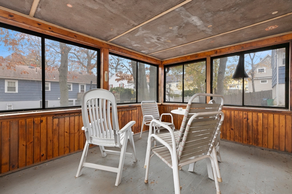 15 Quebec Court Lynn, MA 01905 - Photo 18 of 23 a view of a dining room with furniture large windows and wooden floor
