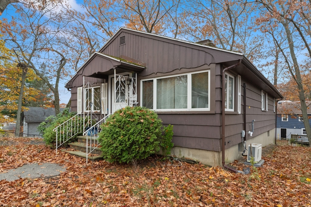 15 Quebec Court Lynn, MA 01905 - Photo 2 of 23 a front view of a house with garden