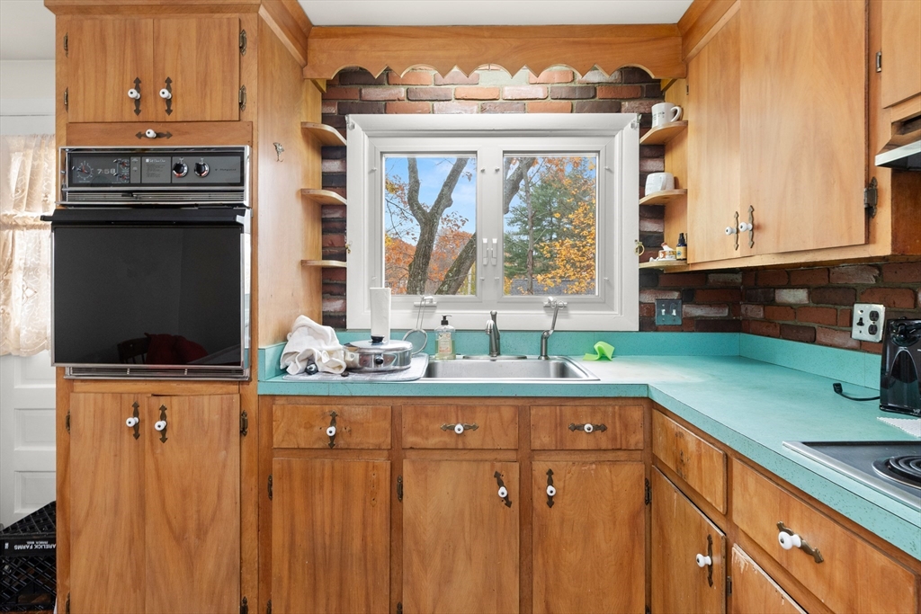 15 Quebec Court Lynn, MA 01905 - Photo 9 of 23 a kitchen with stainless steel appliances a sink and a window