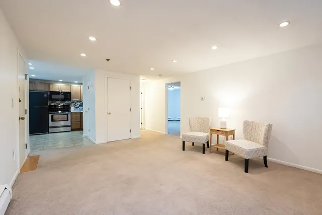 a living room with furniture and a table