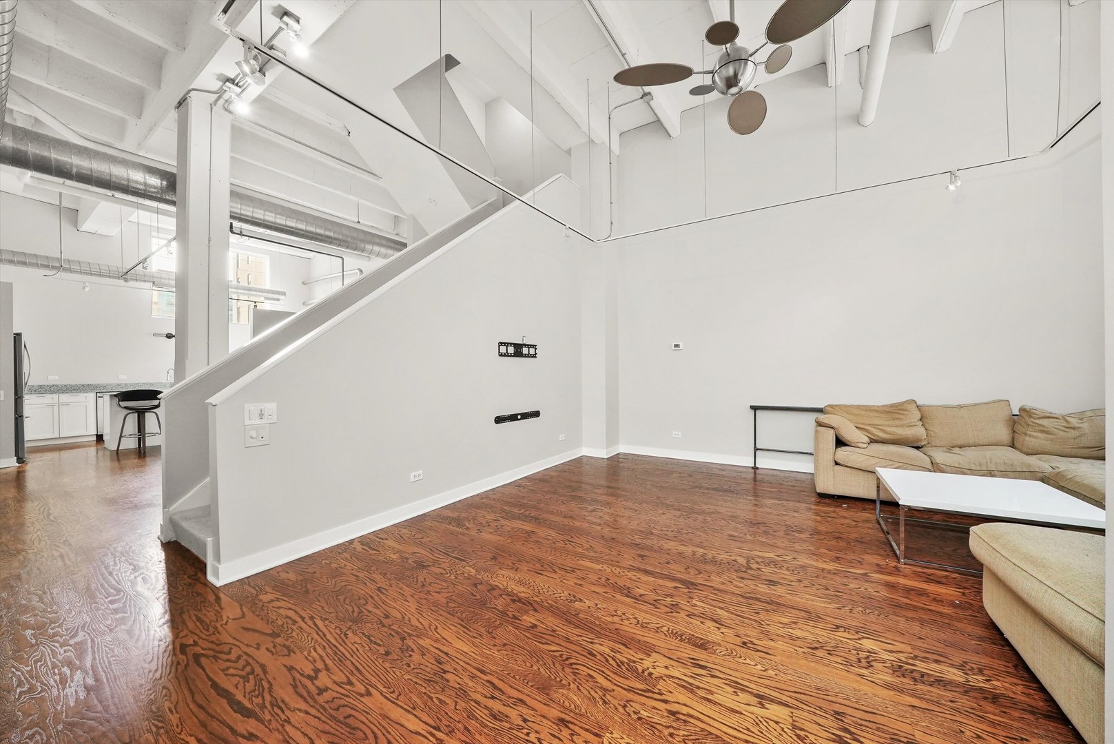 1209 West Cottage Place Chicago, IL 60607 - Photo 7 of 29 a living room with furniture and a floor to ceiling window
