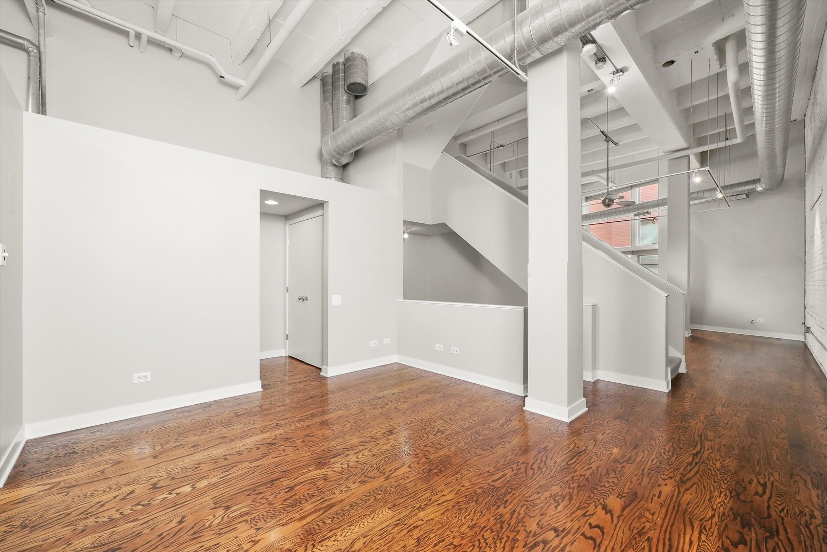 1209 West Cottage Place Chicago, IL 60607 - Photo 10 of 29 a view of entryway and hall with wooden floor
