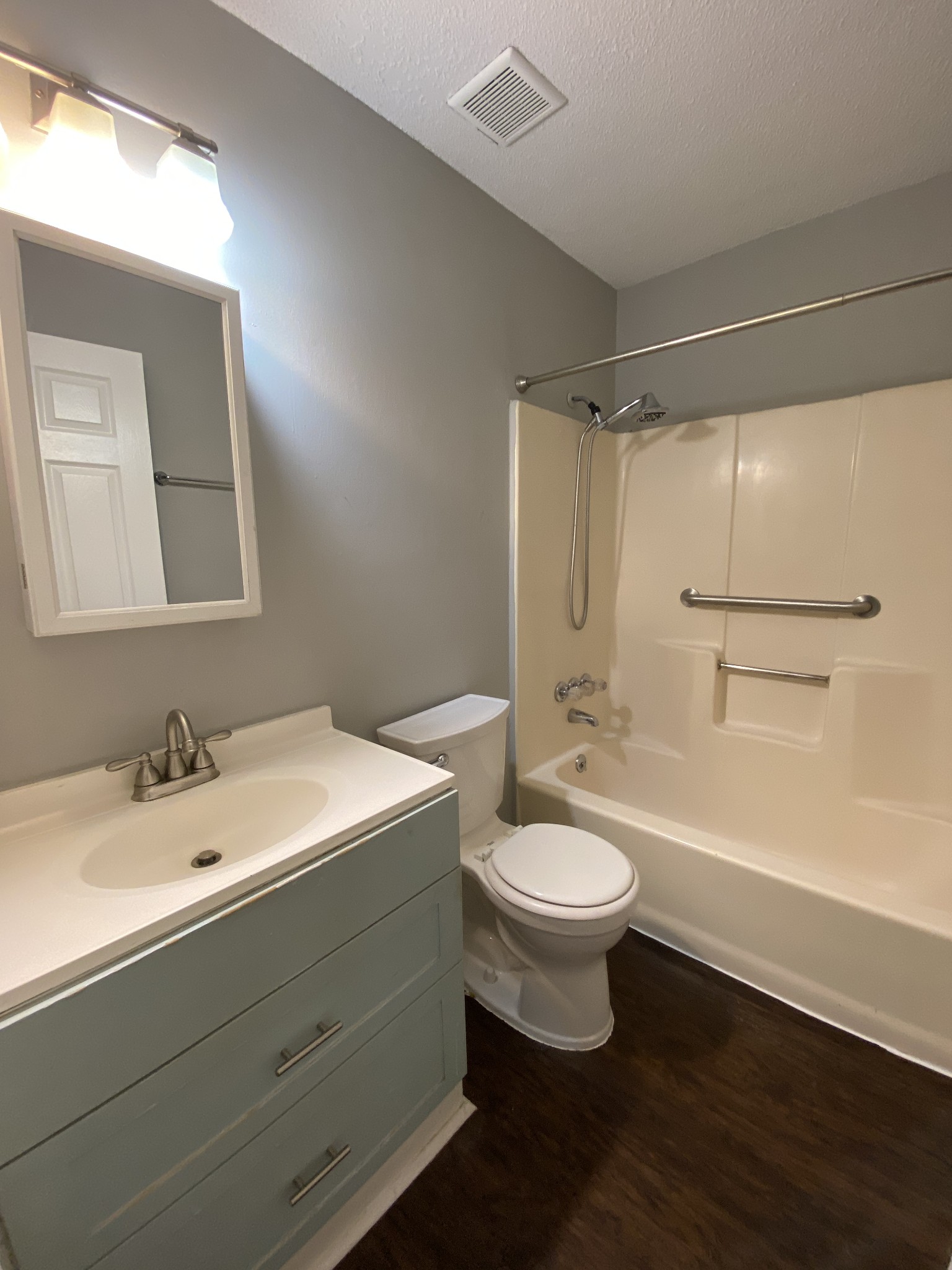 4674 Forest Ridge Drive Hermitage, TN 37076 - Photo 14 of 19 a bathroom with a sink a toilet a mirror and shower