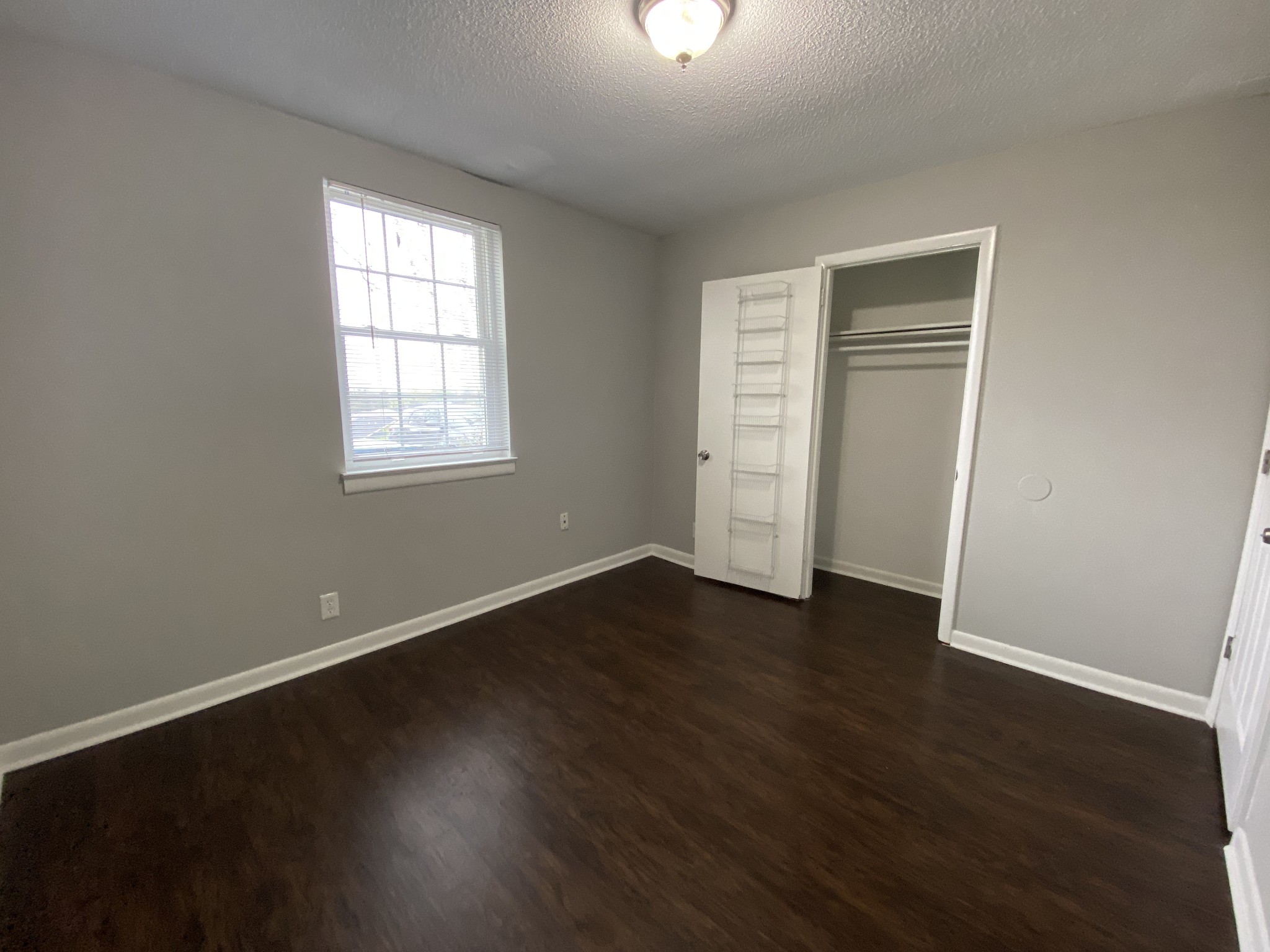 4674 Forest Ridge Drive Hermitage, TN 37076 - Photo 17 of 19 an empty room with wooden floor and windows