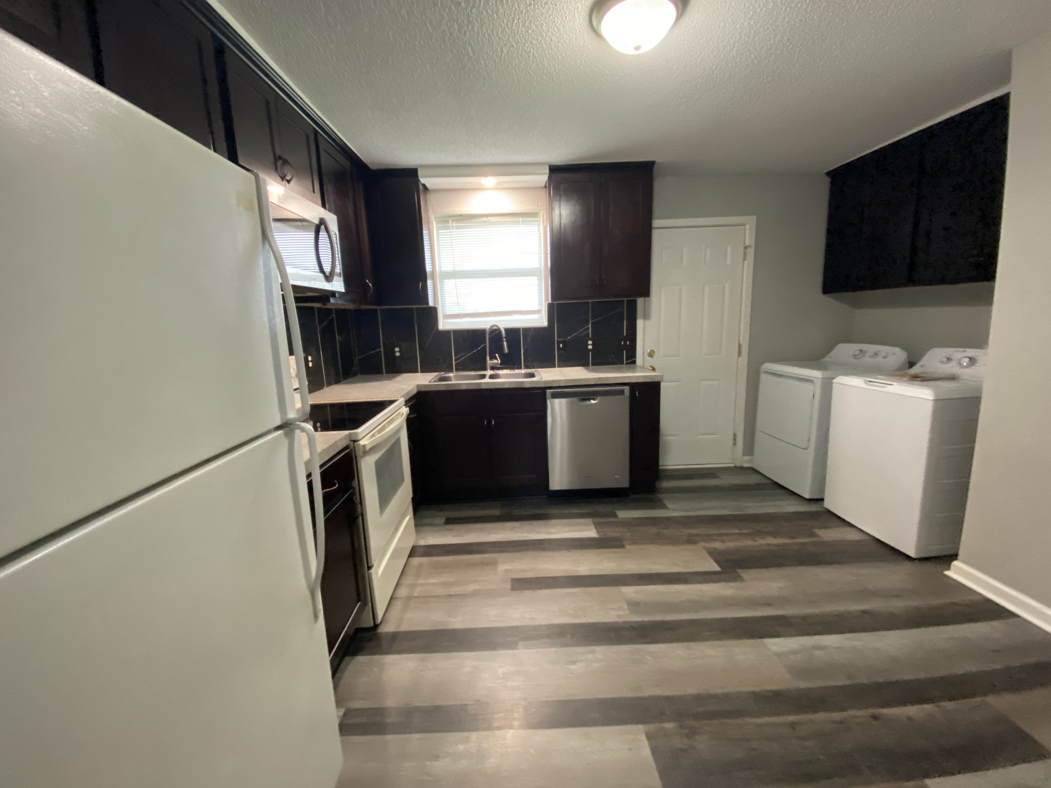 4674 Forest Ridge Drive Hermitage, TN 37076 - Photo 5 of 19 a view of kitchen with sink and refrigerator