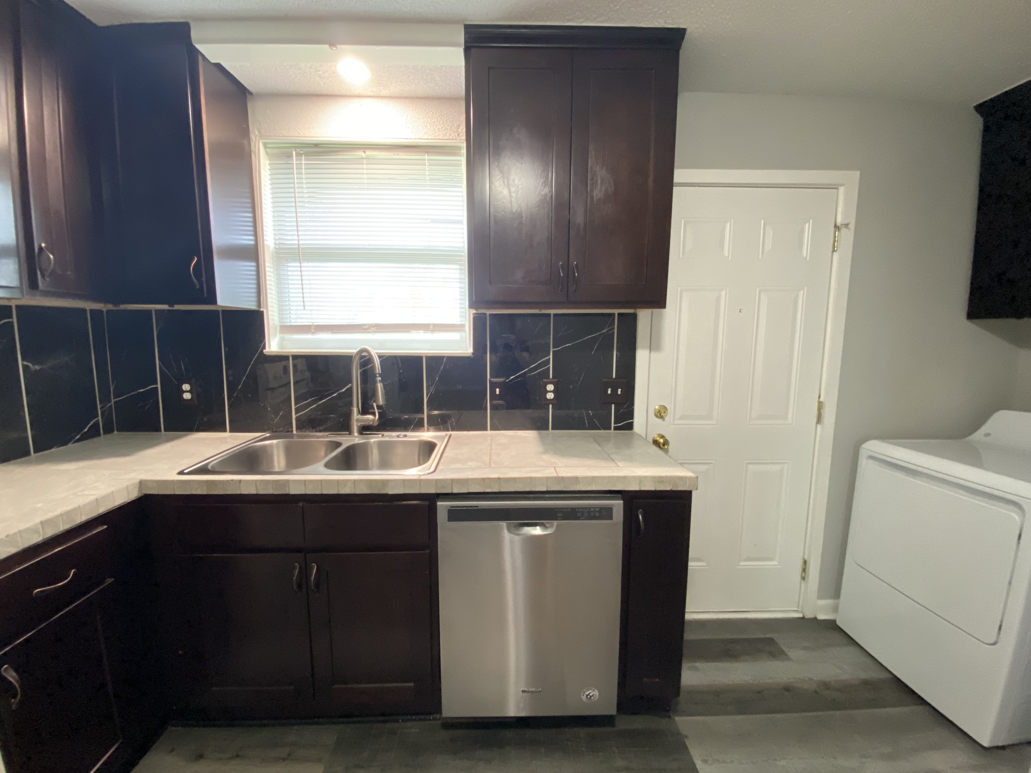 4674 Forest Ridge Drive Hermitage, TN 37076 - Photo 8 of 19 a kitchen with a sink and a stove top oven