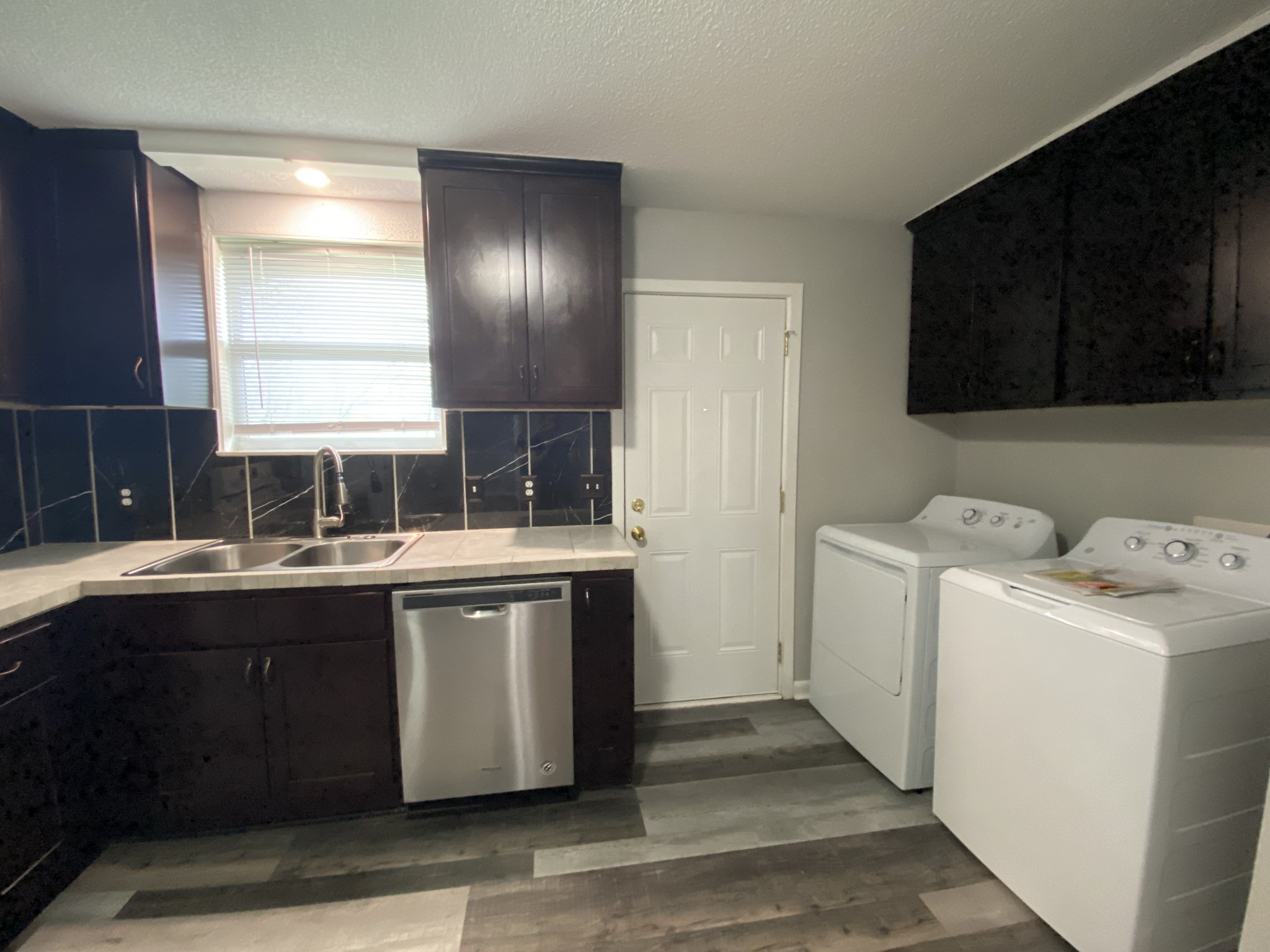 4674 Forest Ridge Drive Hermitage, TN 37076 - Photo 9 of 19 a kitchen with a sink and a stove top oven