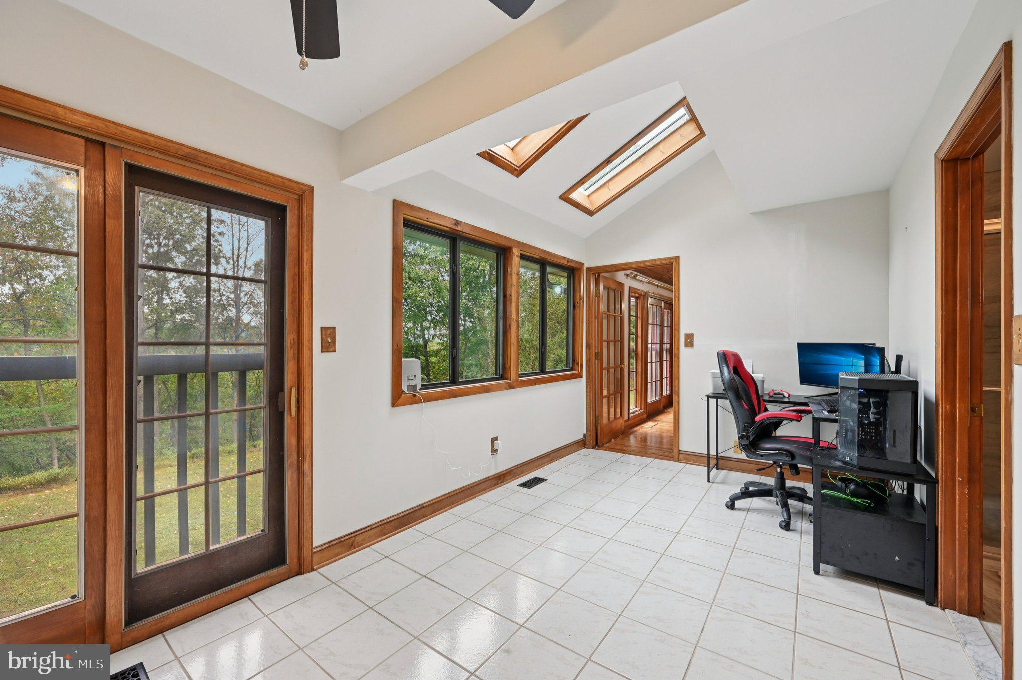 2862 Cox Ridge Road Westminster, MD 21157 - Photo 21 of 64 a view of a workspace with furniture and a window