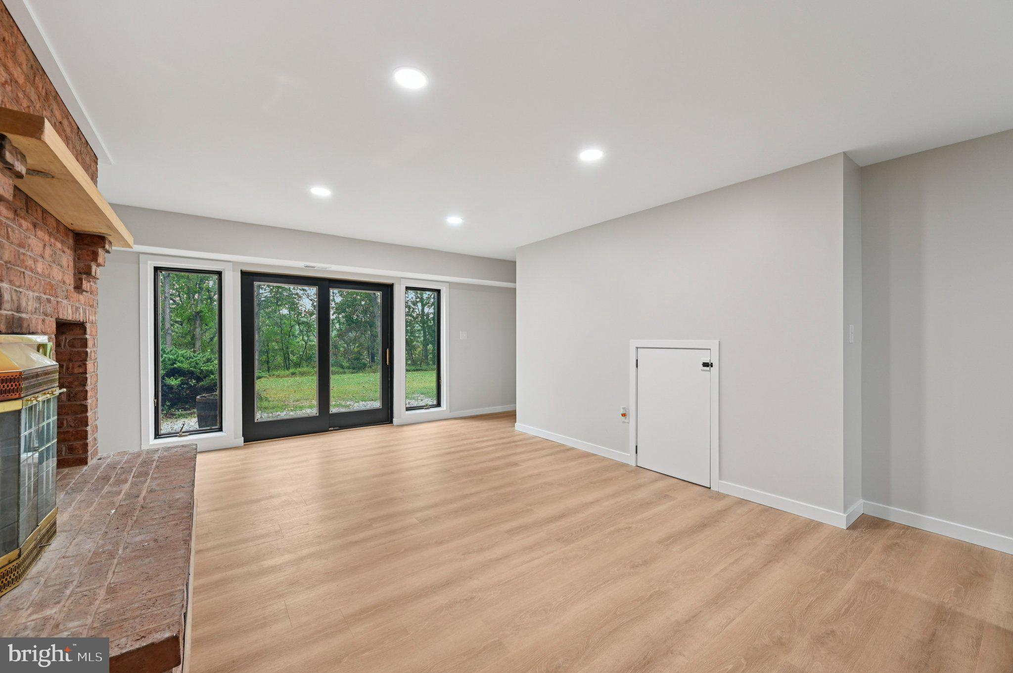 2862 Cox Ridge Road Westminster, MD 21157 - Photo 45 of 64 a view of an empty room with wooden floor and a window