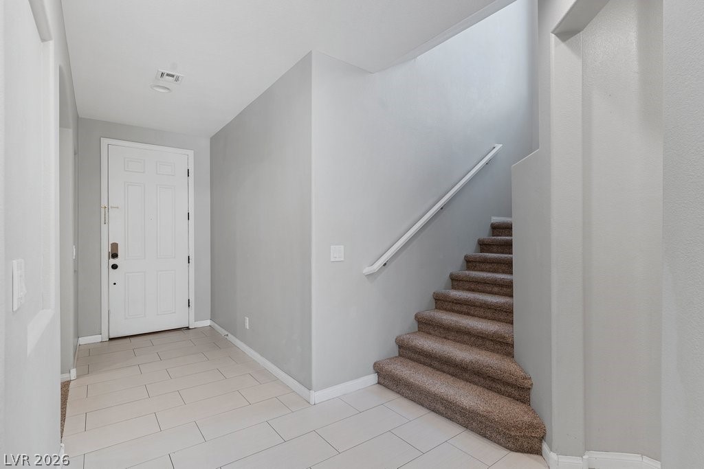 10336 Hawk Ravine Street Las Vegas, NV 89178 - Photo 20 of 59 Enter into a welcoming hallway with upstairs access.