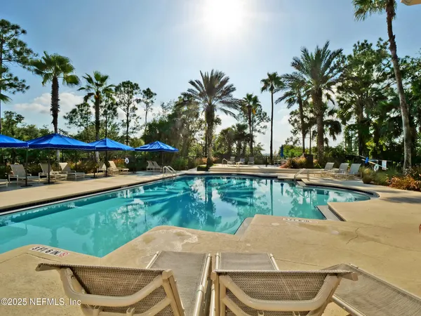 a view of a swimming pool with a patio