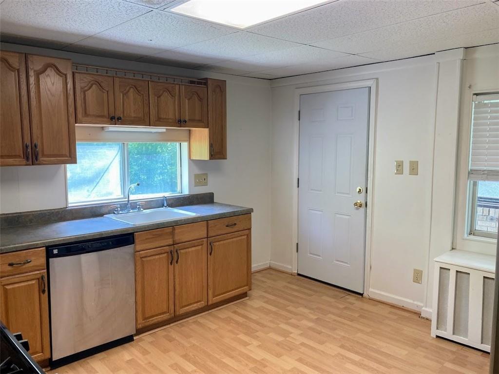 4974 Williamsport Road Elizabeth, PA 15037 - Photo 7 of 34 a kitchen with granite countertop white cabinets and sink