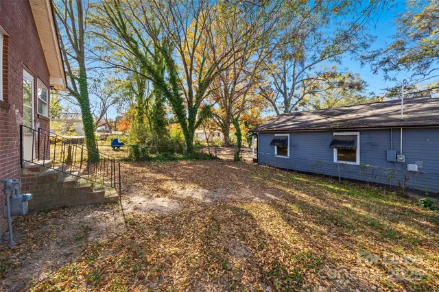 a backyard of a house with lots of green space