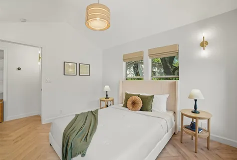 a bedroom with a bed and a table