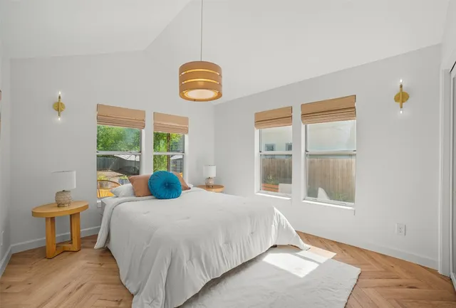 a bedroom with a bed and window