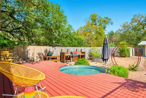 a view of a swimming pool with a patio