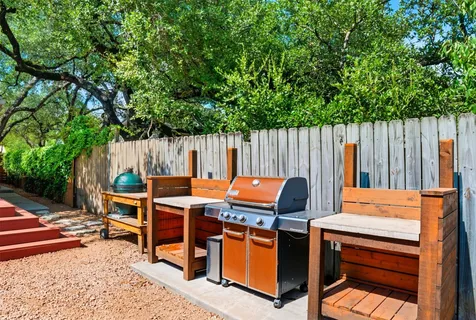 a view of a wooden chairs in a patio