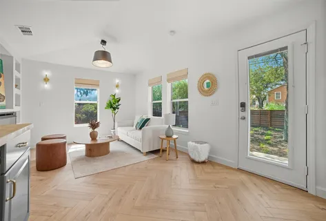 a living room with furniture and a window
