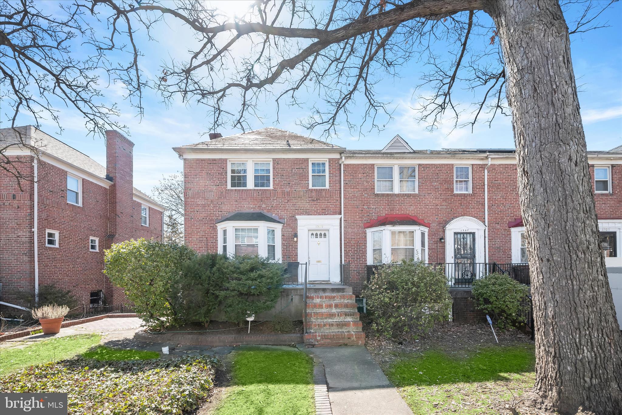 1509 Shadyside Road Baltimore, MD 21218 - Photo 1 of 38 a front view of a house with a garden