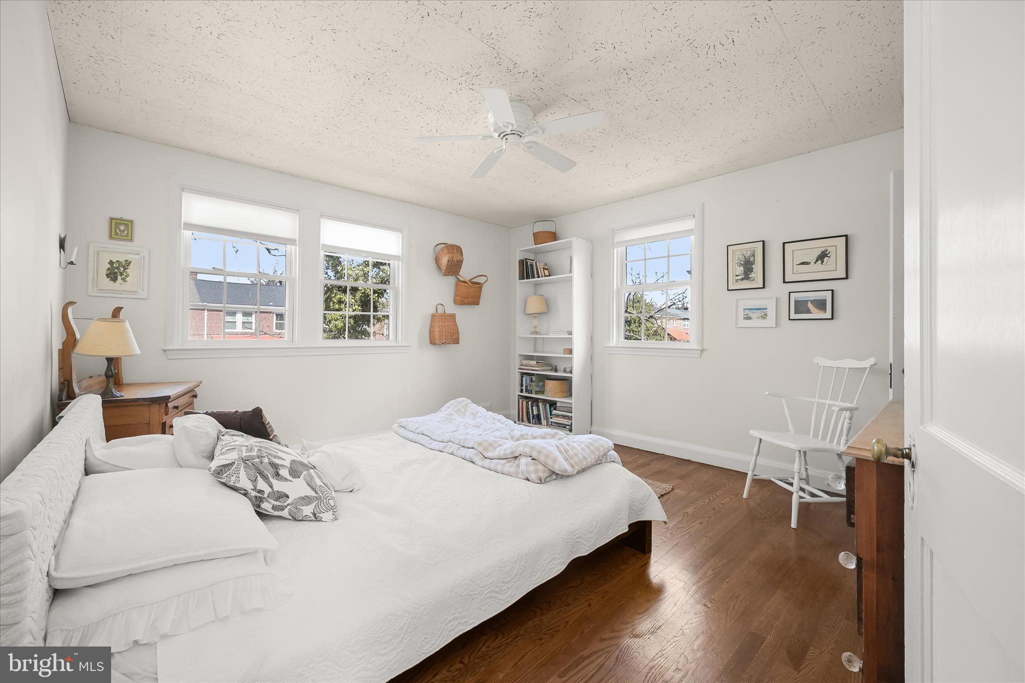 1509 Shadyside Road Baltimore, MD 21218 - Photo 21 of 38 a bedroom with a bed and wooden floor