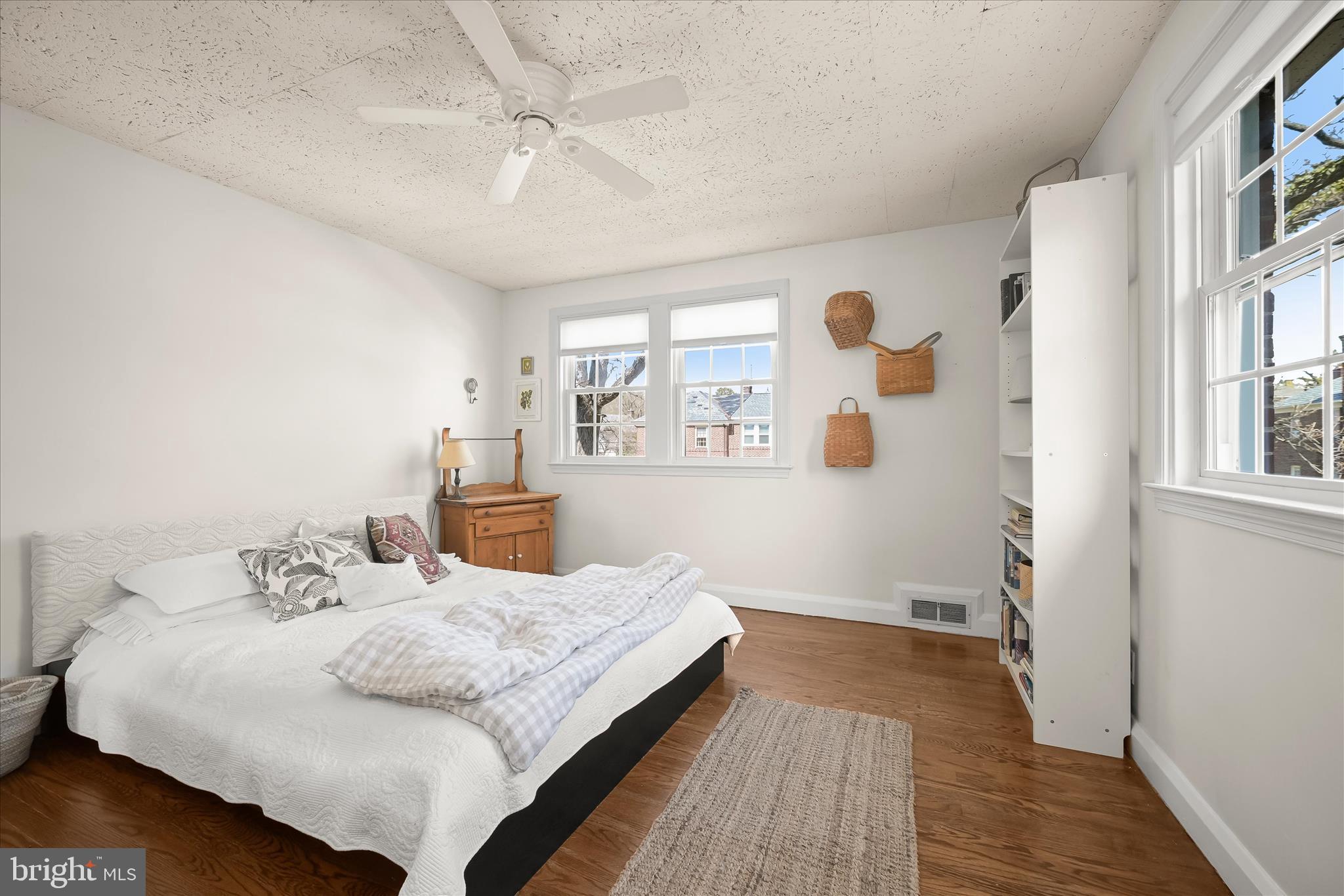 1509 Shadyside Road Baltimore, MD 21218 - Photo 22 of 38 a bedroom with a bed and wooden floor