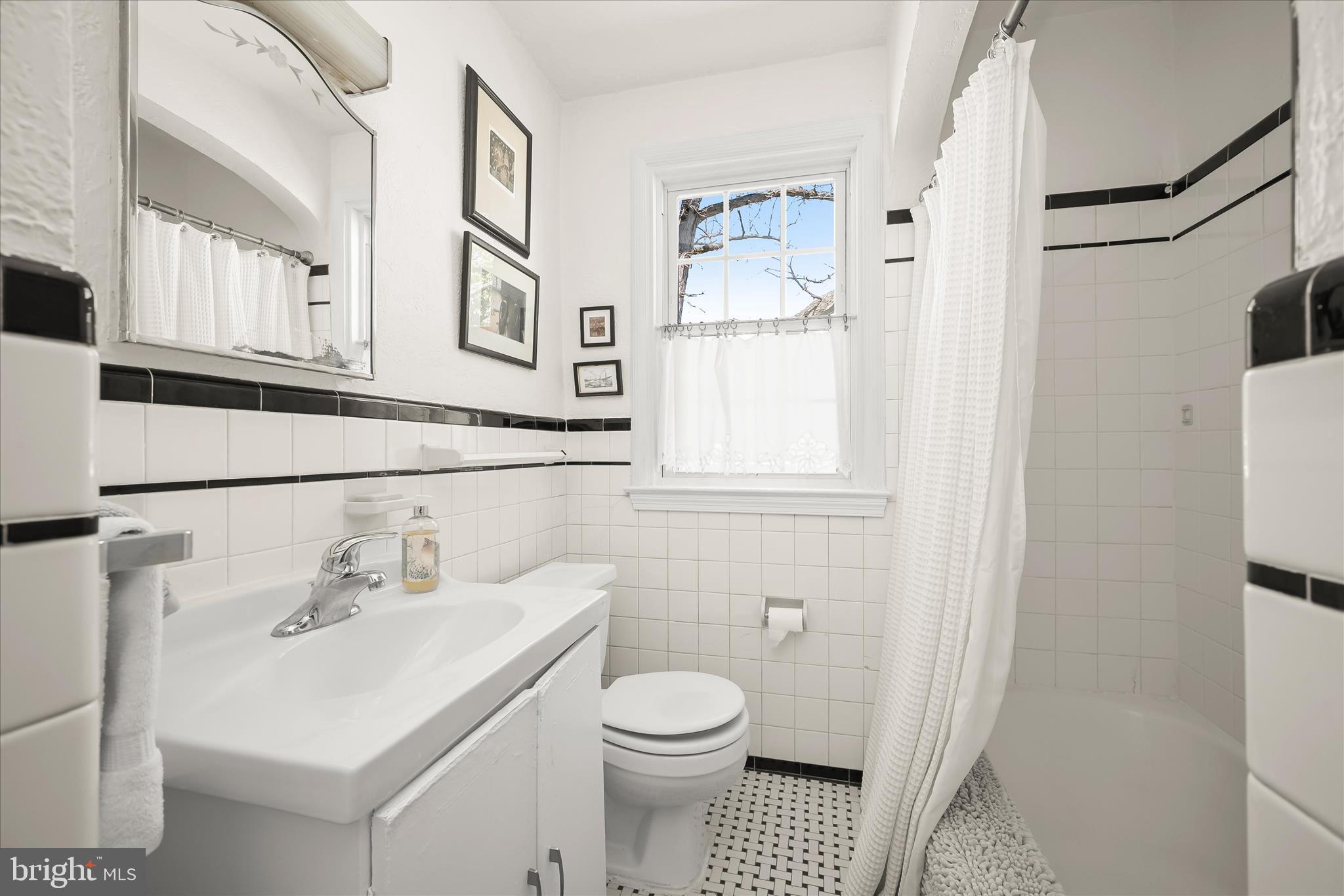 1509 Shadyside Road Baltimore, MD 21218 - Photo 23 of 38 a bathroom with a sink toilet and shower