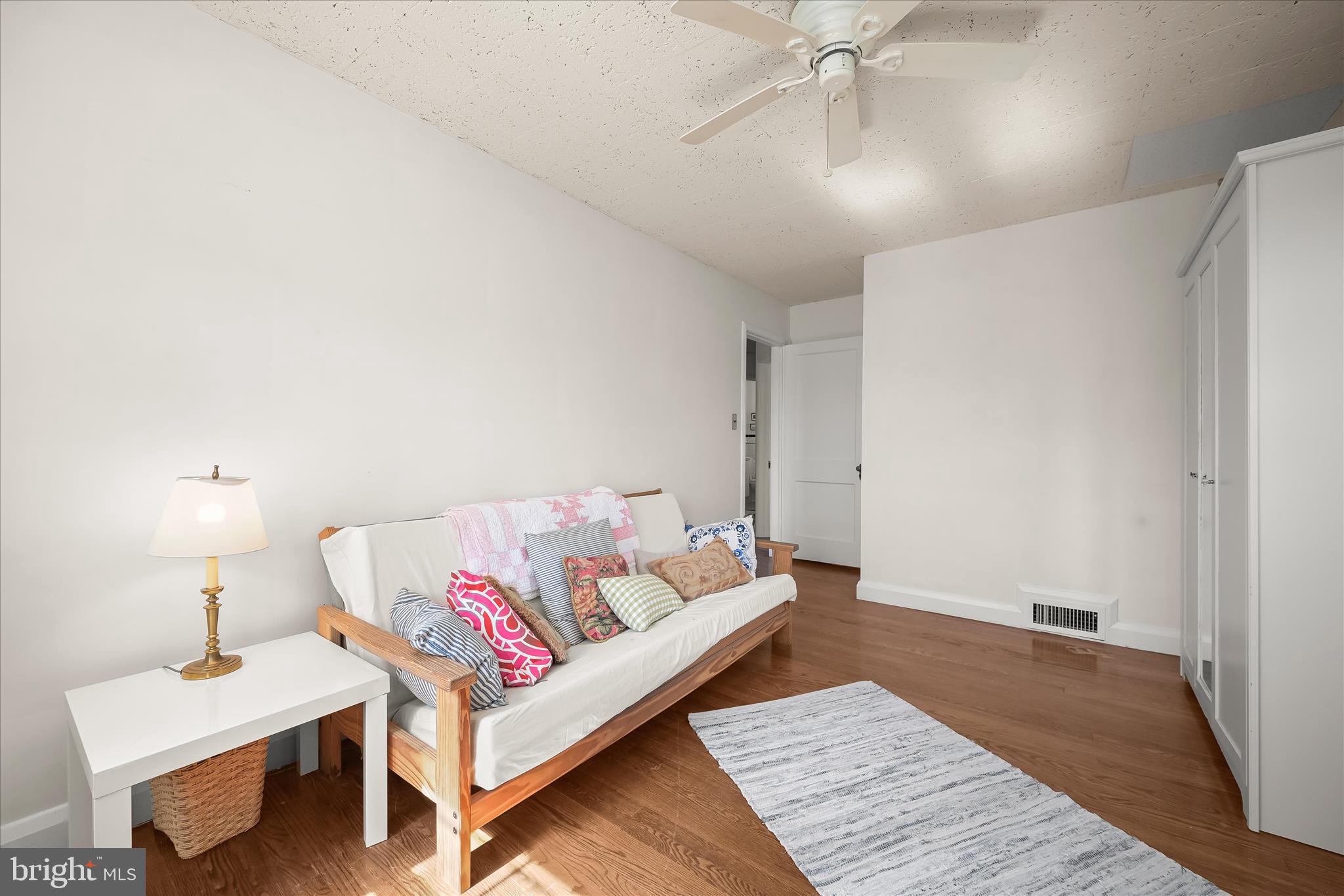 1509 Shadyside Road Baltimore, MD 21218 - Photo 25 of 38 a living room with furniture and a lamp