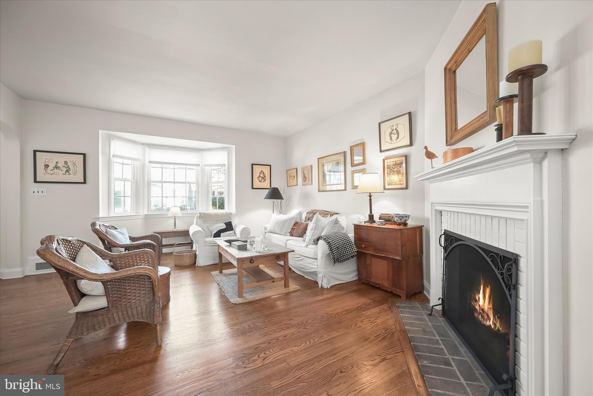 1509 Shadyside Road Baltimore, MD 21218 - Photo 4 of 38 a living room with furniture large window and fireplace
