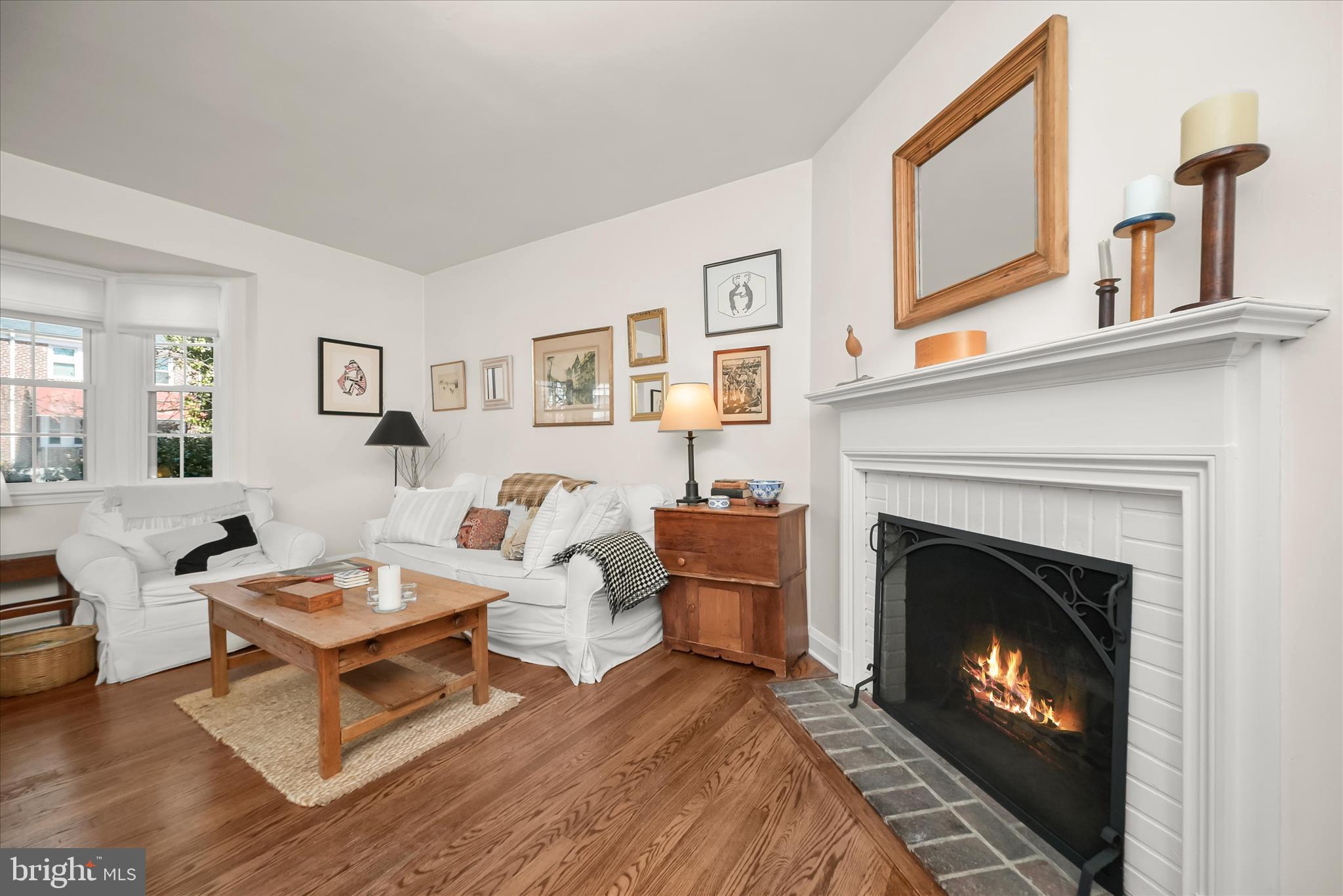 1509 Shadyside Road Baltimore, MD 21218 - Photo 7 of 38 a living room with furniture a fireplace and a table