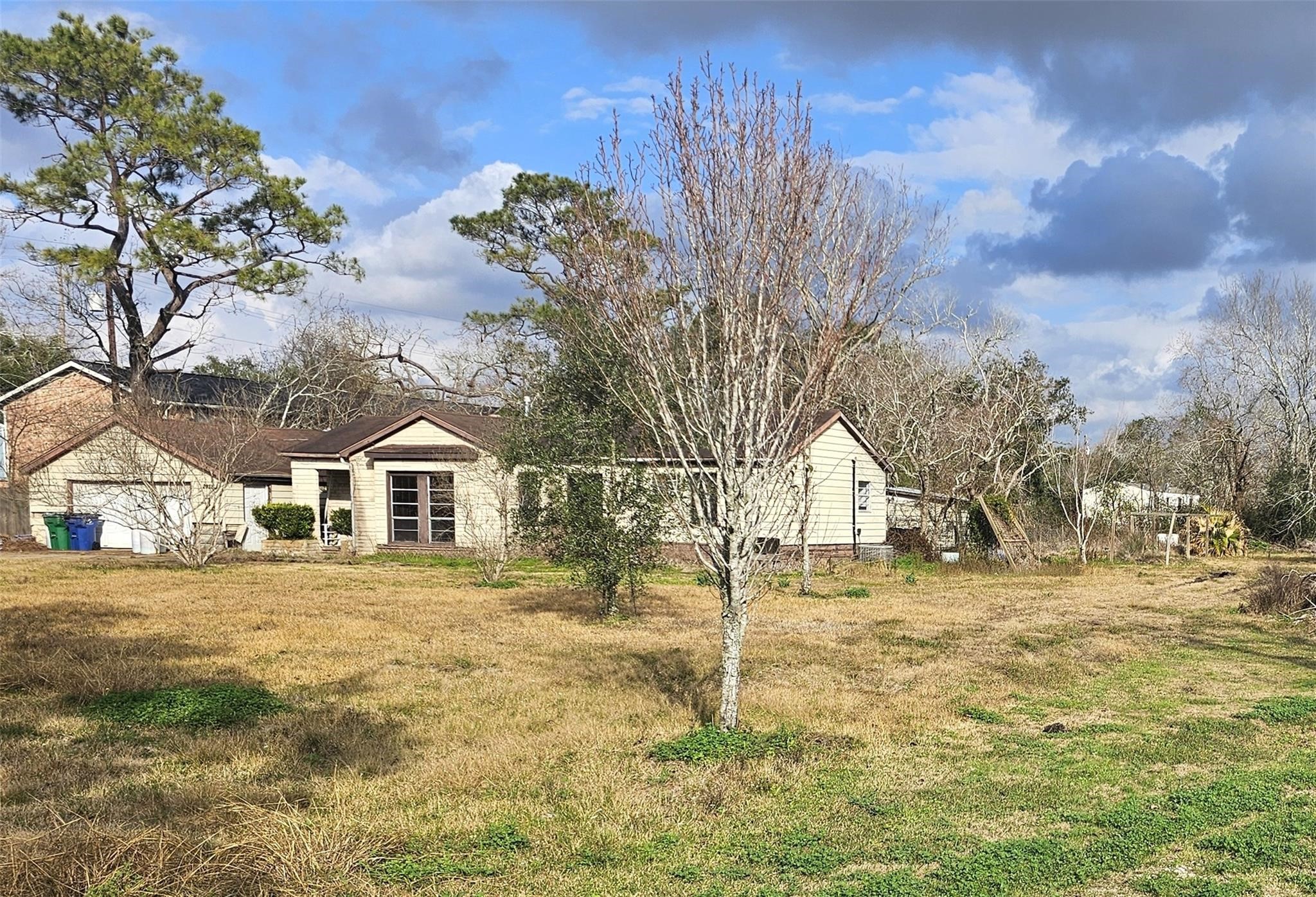2025 Shanks Road Angleton, TX 77515 - Photo 4 of 5 a front view of a house with a yard
