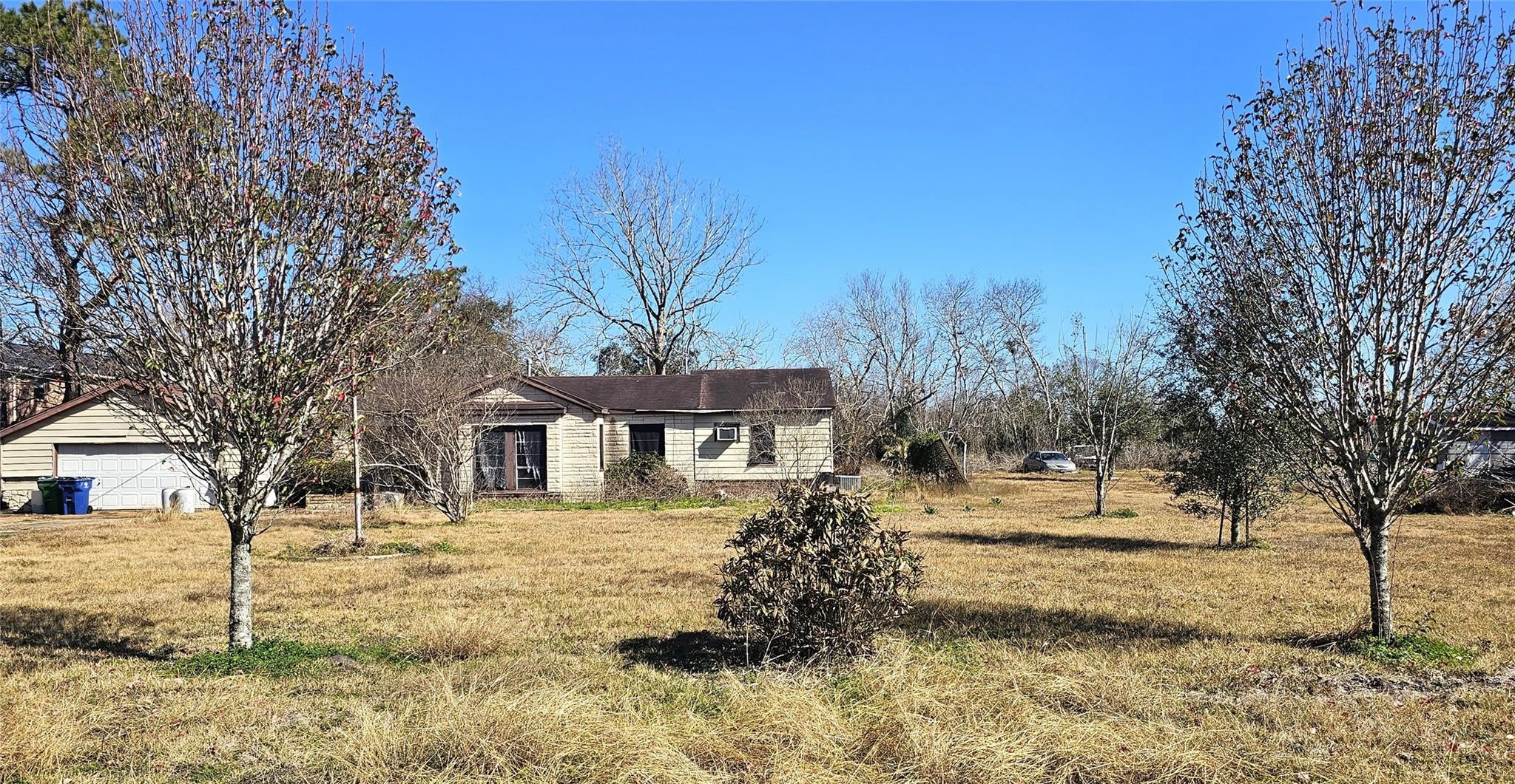 2025 Shanks Road Angleton, TX 77515 - Photo 5 of 5 a front view of a house with a yard covered with snow